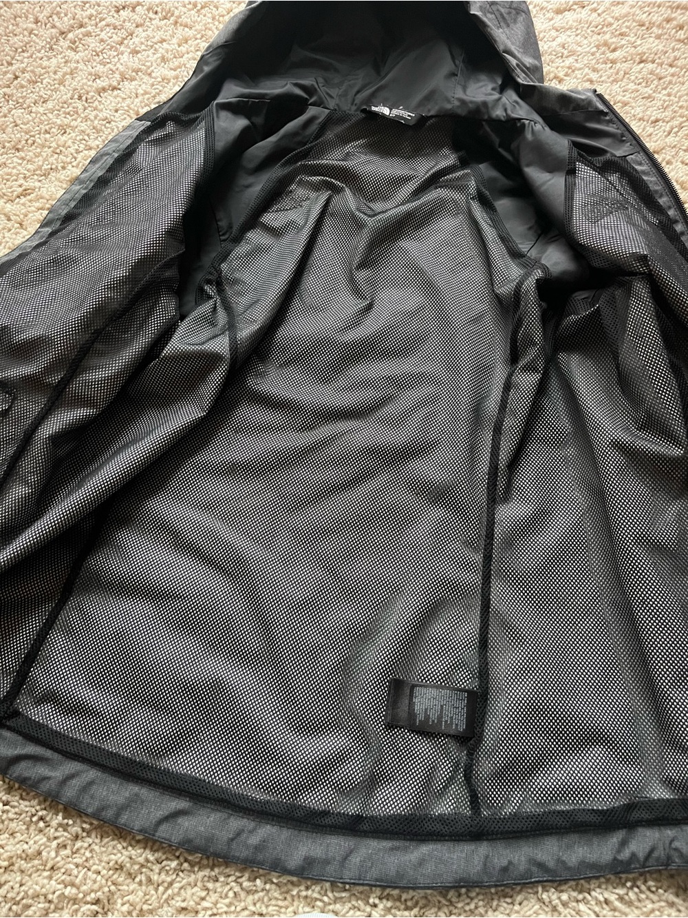The North Face gray Hooded Raincoat with Mesh Lining.
